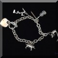 J01. Silver charm bracelet, 